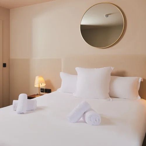 Les Trois Voiles Hotel standard room and bathroom
