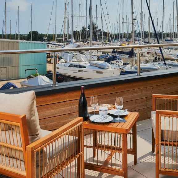 Les Trois Voiles Hotel Deluxe room: terrace with port view