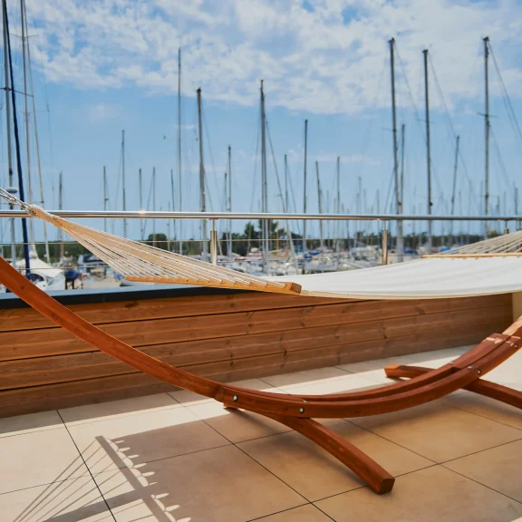 Les Trois Voiles Hotel Deluxe room: terrace with port view